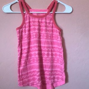 Pink tank top with pattern at the front of the shirt